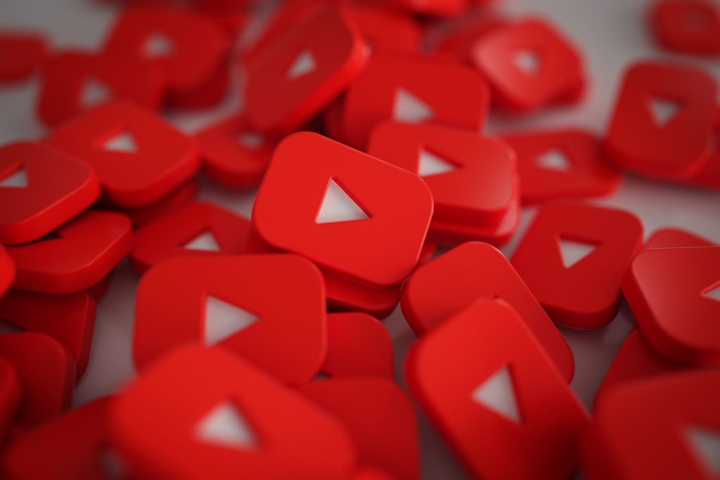 Pile of 3D Play Button Logos